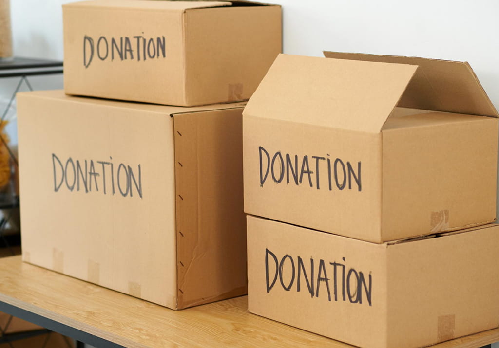 Boxes of donated household goods loaded for haul away