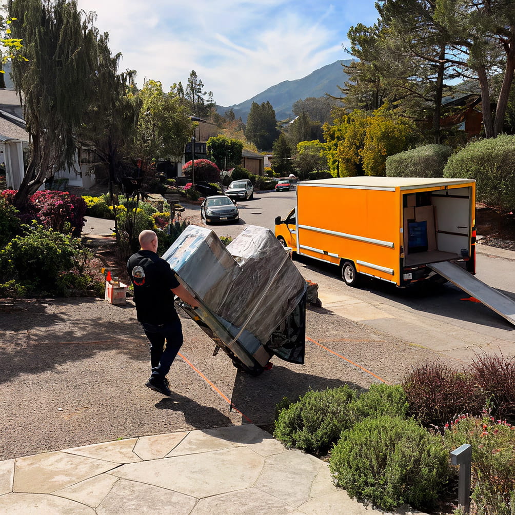Local movers loading household boxes into a truck in Petaluma, California